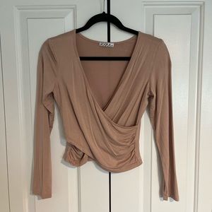 Nude/beige pink long sleeve crop top.